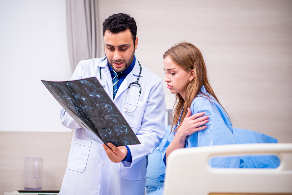 Medical staff reviewing patient records and diagnostic procedures to mitigate errors and ensure accurate diagnoses.