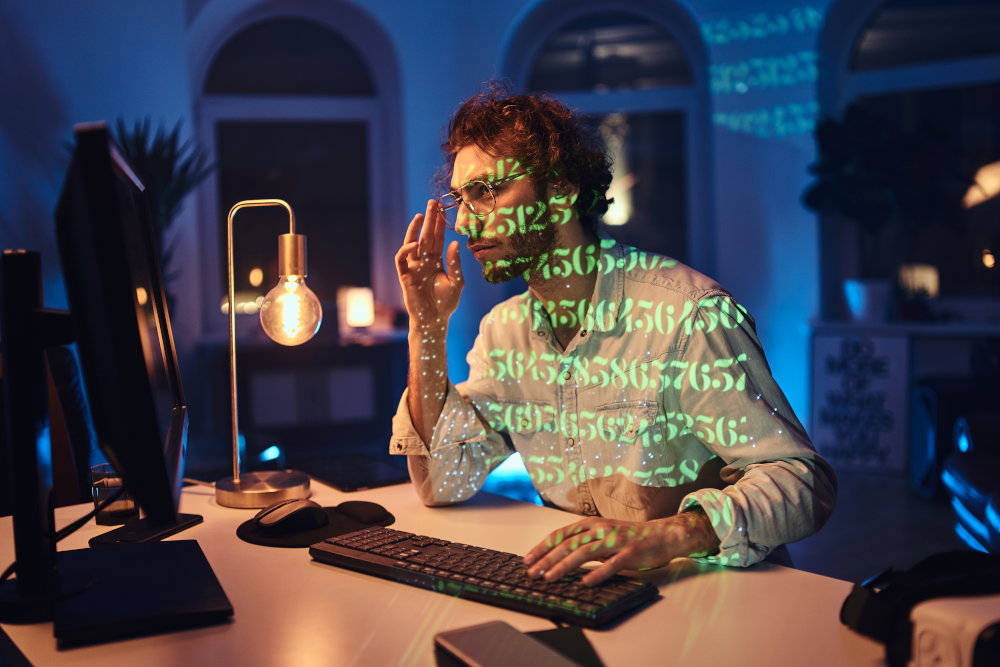 Cybersecurity professional analyzing data on a computer screen, harnessing dark web intelligence to combat cyber threats and enhance cybersecurity strategies.