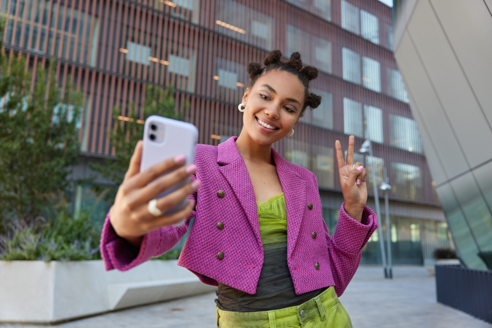 An influencer records engaging content from her smartphone, targeting Gen Z social media use. This authentic partnership showcases micro-influencers, promoting customer-centric campaigns for significant business growth.